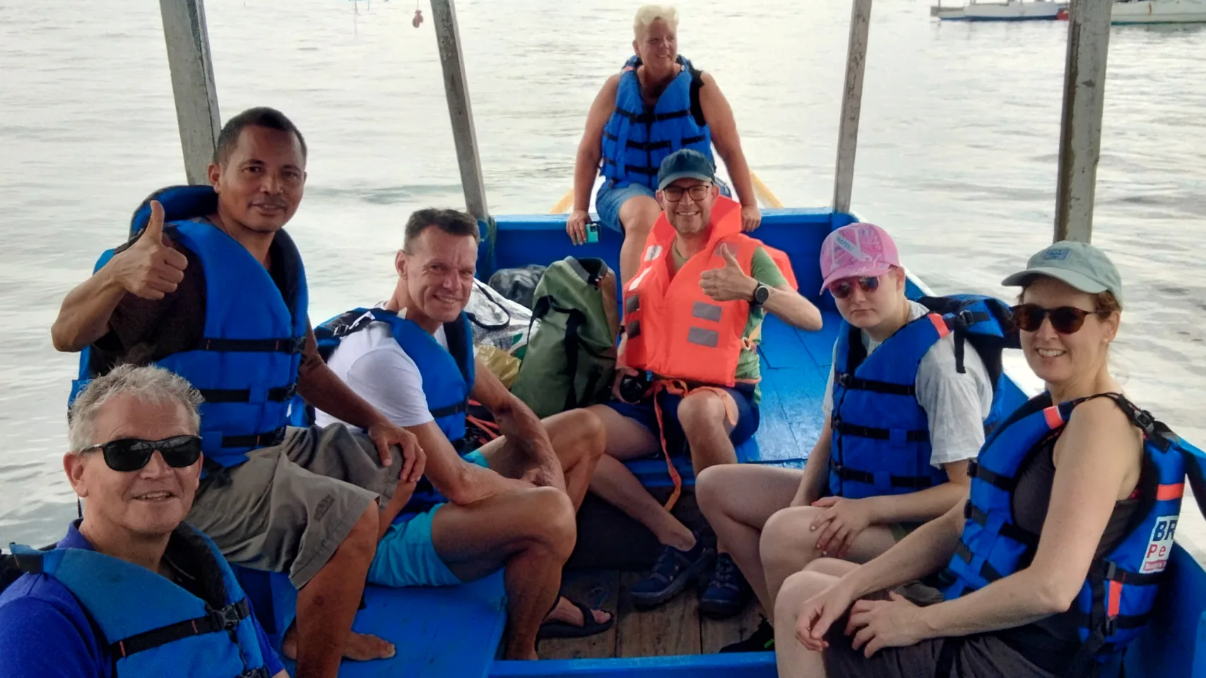 Enjoying a scenic coastal boat ride along the beautiful Flores coastline.