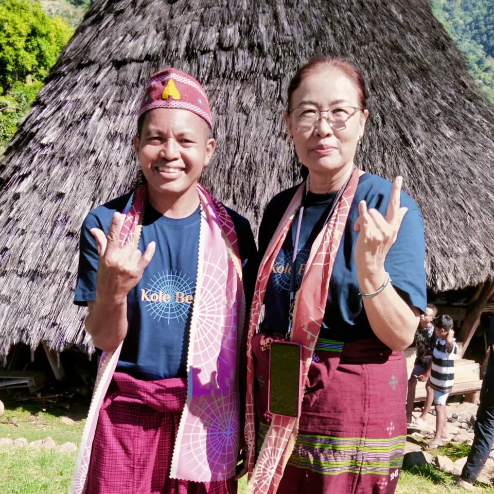Sharing joyful moments and making memories in traditional village attire.
