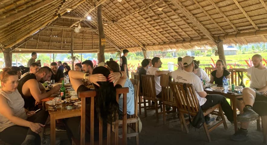 Guests sharing a home-cooked meal at Waerebo Lodge Restaurant