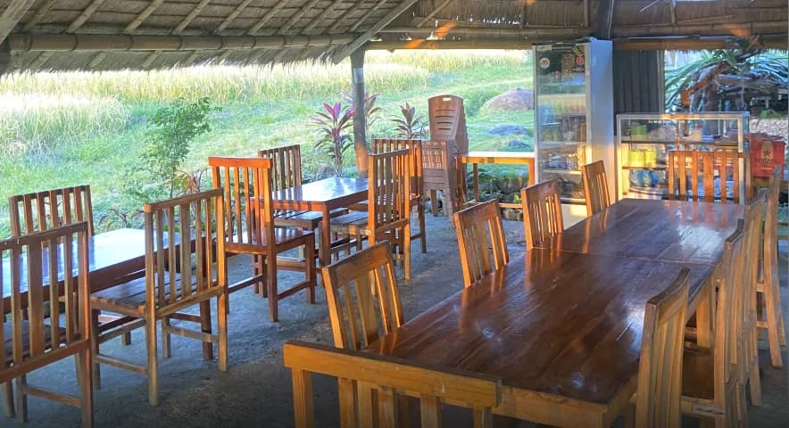 Guests sharing a home-cooked meal at Waerebo Lodge Restaurant