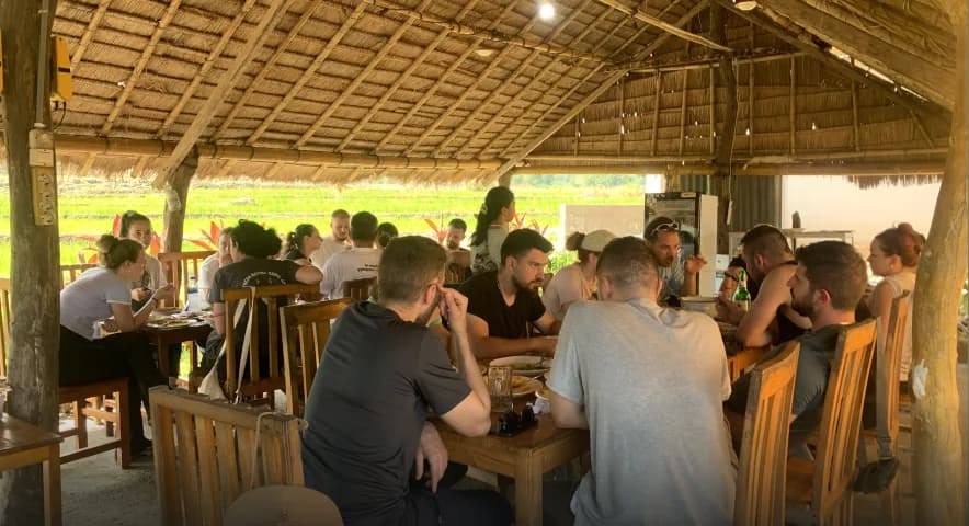 Guests sharing a home-cooked meal at Waerebo Lodge Restaurant